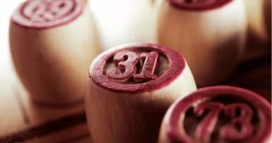 Close-up of numbered wooden chips, with the number 31 prominently displayed in focus.